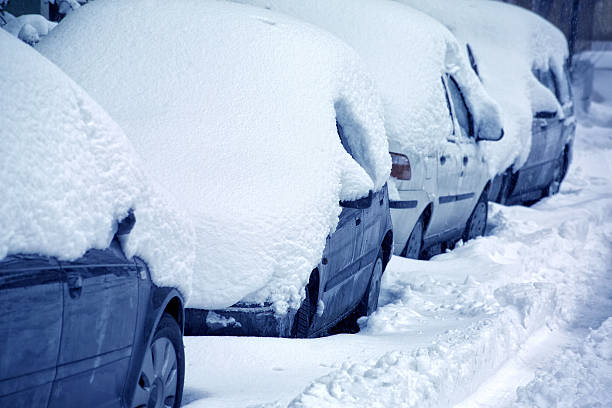 istock snow covered cars 636757954