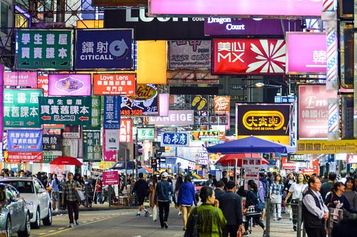 Hong Kong street scene with neon signs at night