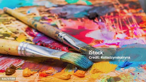 Used Brushes On An Artists Palette Of Colorful Oil Paint Stock Photo - Download Image Now