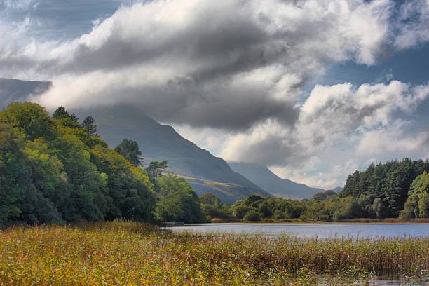 istock Mountain behind a lake under a moody sky 636761884