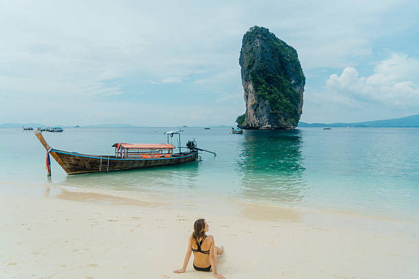 istock Woman on the beach in Thailand 636765818