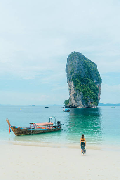 istock Woman on the beach in Thailand 636765828