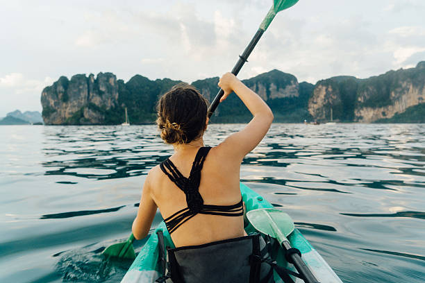 istock Woman kayaking in the sea 636768518