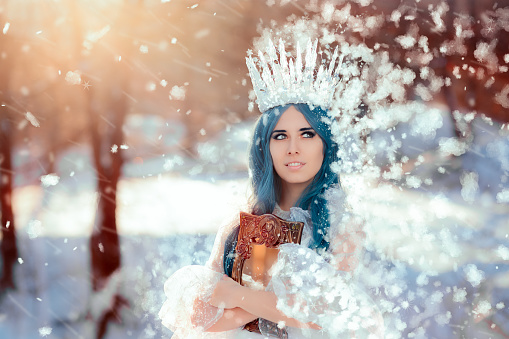 Beautiful princess with ice crown and blue hair