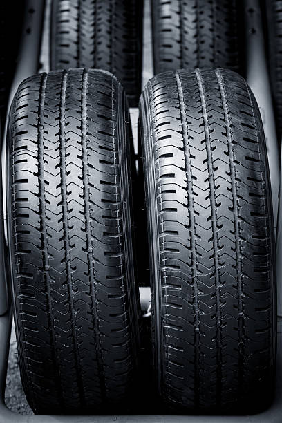 istock Clean Tyre, black new shiny car tire 636770244