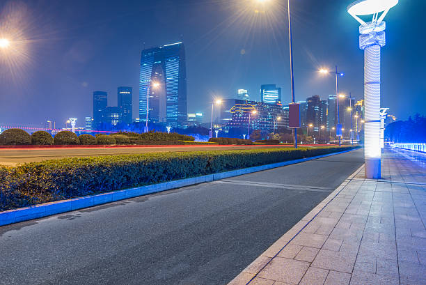 istock urban traffic road at night 636772058