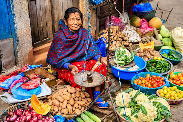Indian street seller in Kathmandu Indian vegetable seller on the streets of Kathmandu, Nepal. nepal stock pictures, royalty-free photos & images