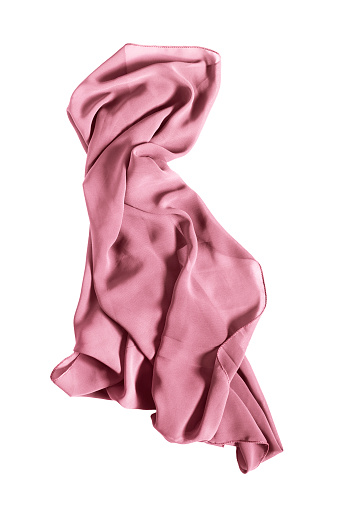 Pink silk kerchief draped on white background