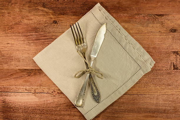 istock Vintage fork and knife on wooden background 636776316