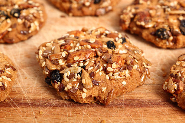 istock Multi seed cookies on wooden board 636776370
