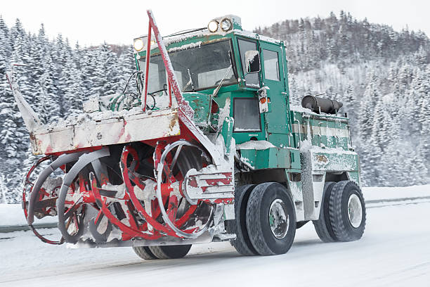 istock machine cleans snow from the road 636777206
