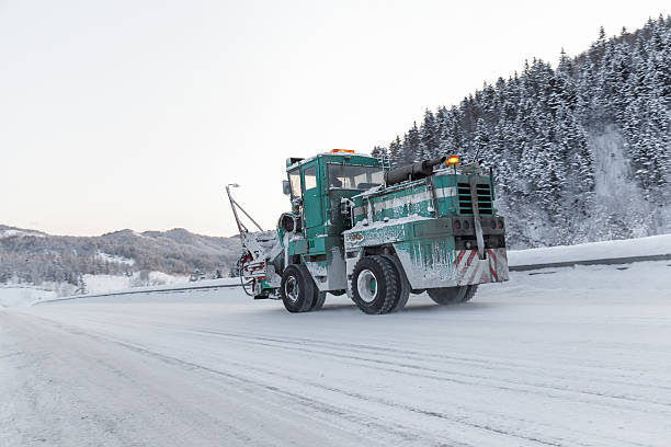 istock machine cleans snow from the road 636777262