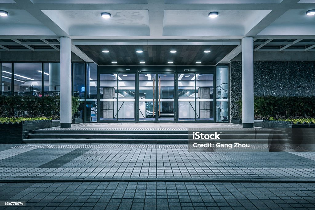 modern building gate empty pavement front of modern building entrance,Hong Kong,china. Building Entrance Stock Photo