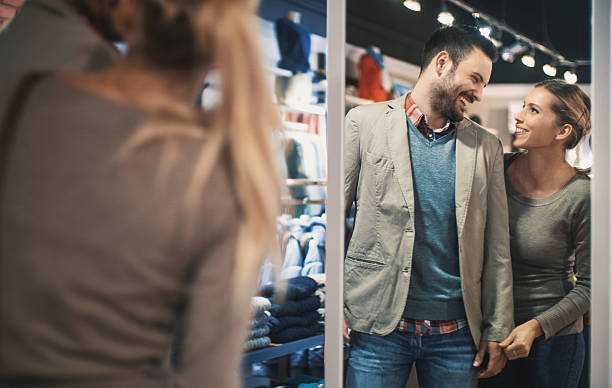 istock Couple buying clothes at department store. 636779652