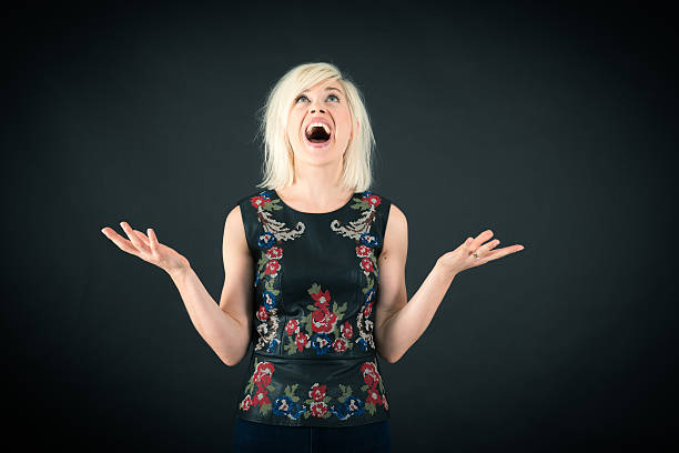 istock Beautiful woman doing different expressions in different sets of clothes: joy 636780132