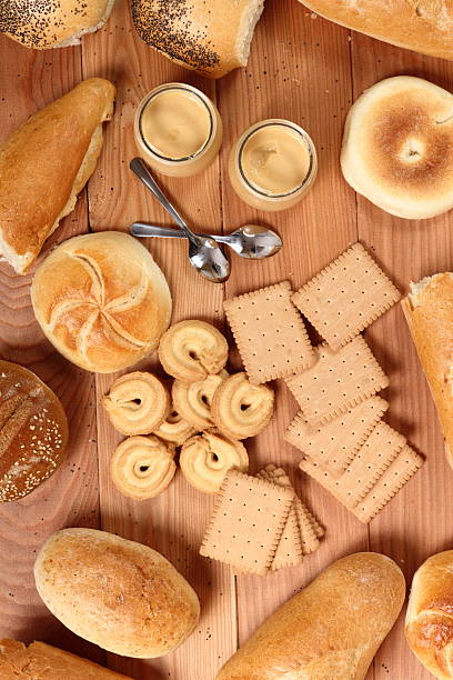 istock Milk pudding dessert in jar, bread rolls and cookies 636780412