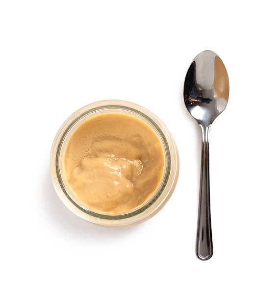 istock Milk pudding dessert in jars. Isolated with clipping path. 636780780