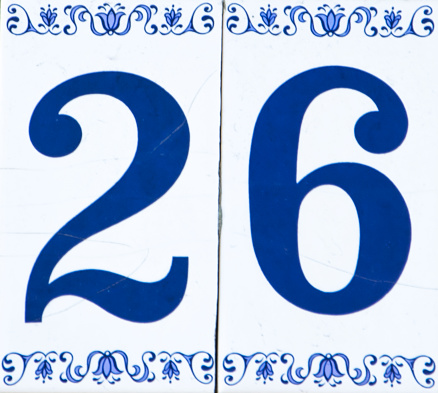 Traditional Italian home sign board painted on ceramic tile placed on the wall..Number twenty-six (26)