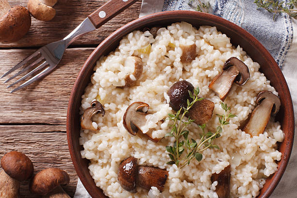 istock Italian rice with wild mushrooms closeup on the table. Horizontal 636783030