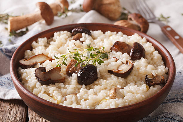 istock Italian risotto with wild mushrooms close up on the table 636783240