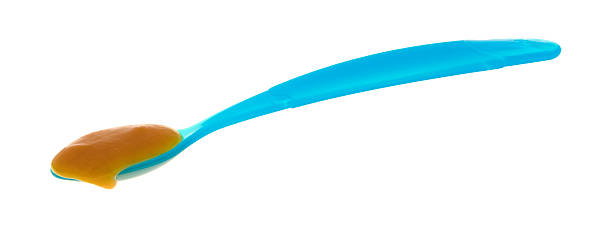 istock Baby food on a blue spoon 636783284