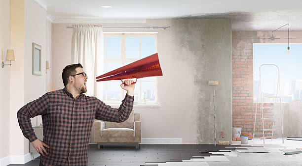 istock Hipster man shout in trumpet . Mixed media 636785902