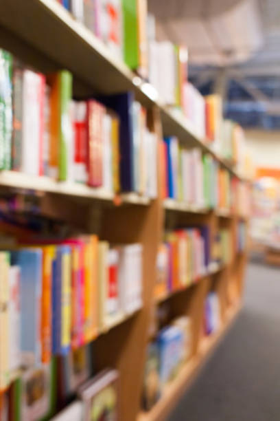 istock Blurred bookshelves with colorful books. 636786730