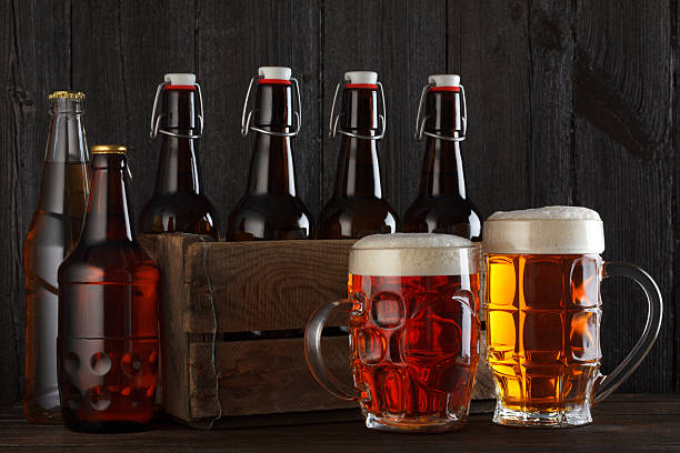 Four beer bottles on white background.