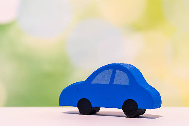 istock Auto Concept.  Toy Car on Green Background 636789244