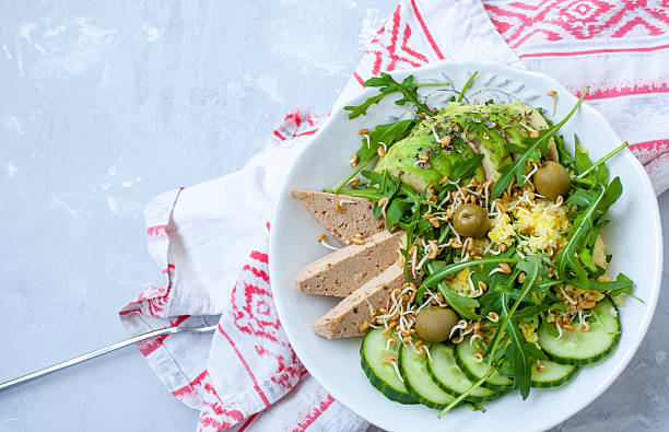 istock Green salad with avocado, couscous and tofu 636790164