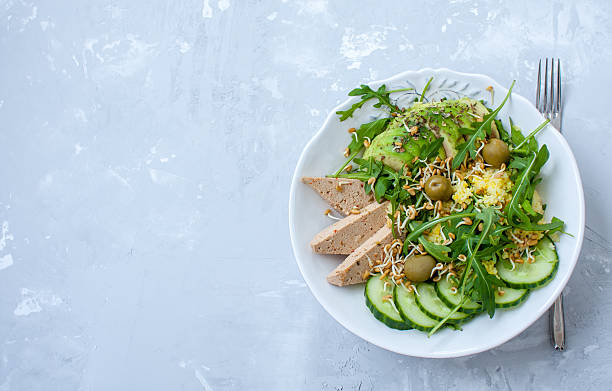 istock Green salad with avocado, couscous and tofu 636790184