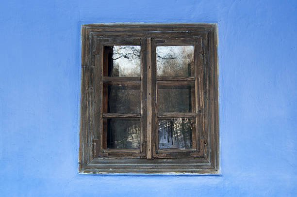 istock Old house window on colorful wall background. 636792232