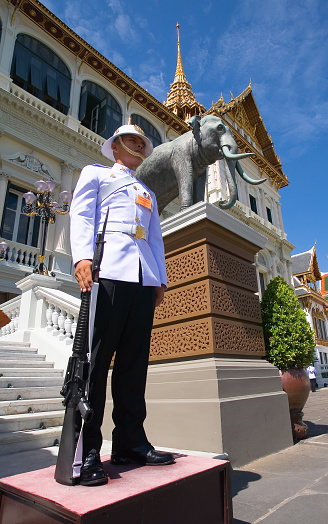 Bangkok, Thailand, May 14, 2013. Thai soldier in dress uniform standing on guard. On the temple grounds.