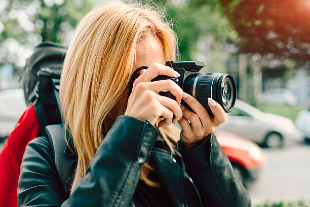 istock Female Backpacker In The City Photographing. 636793948