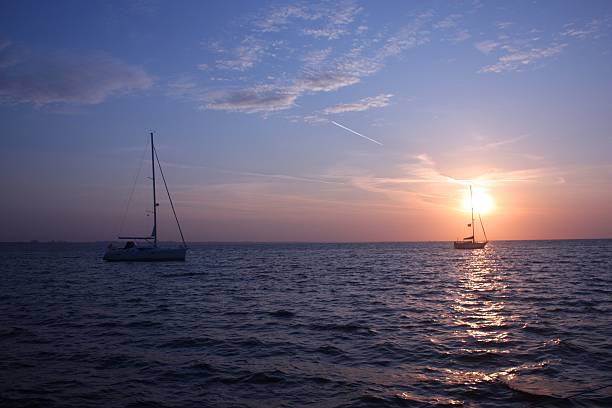 istock yachts at anchor in studland bay with sunrise 636794318