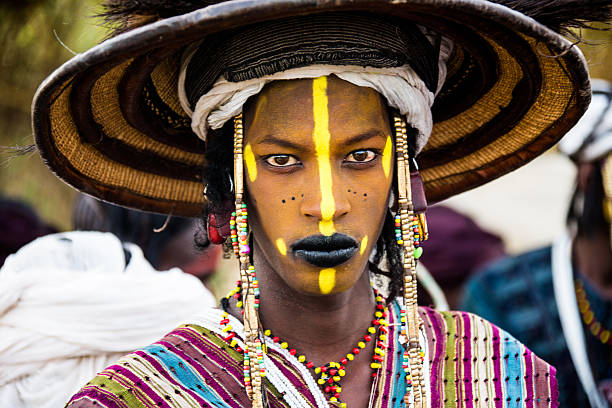 Tahoua, Niger - September 29, 2016: The Gerewol Festival is celebrated by the Peul nomads in the Sahel zone Niger. Young man are painting their faces and dance in colorful clothes to impress the young girls. it is like a market for marriage. Gerewol is also a big meeting of the different tribes and families at the end of the rainy season, it lasts about tow weeks and ist an absolute highlight in the life of the nomads.