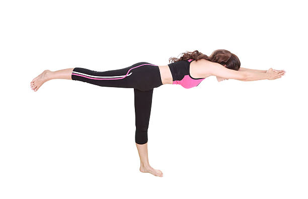 istock Young woman doing yoga exercise 636795434