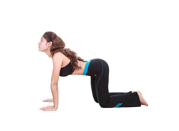 istock Young woman doing yoga exercise 636795492