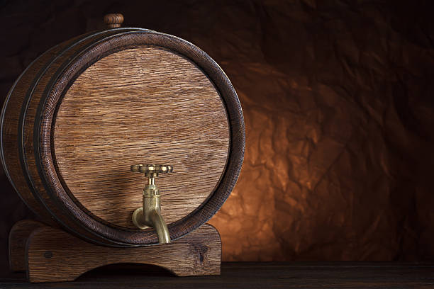 istock Beer barrel on wooden table 636795894