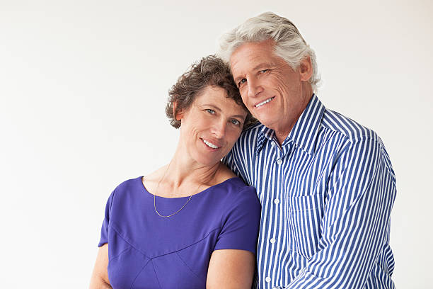 istock Happy Elderly Couple Hugging and Smiling 636797752