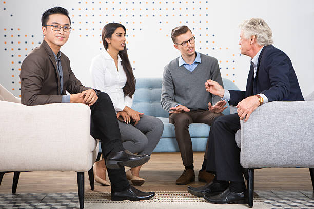 istock Smiling Business Man and Partners Discussing Ideas 636797994