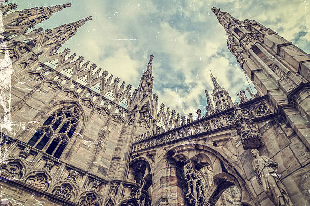 istock Old photo with architectonic details from the Milan Cathedral 636800734