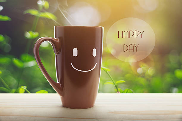 istock Brown mug of coffee with a happy smile 636800864