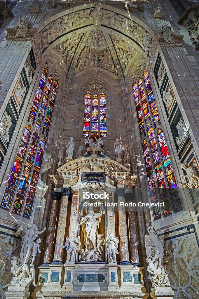 Old photo with interior at the Milan cathedral Old photo with interior at the Milan cathedral. One of the secondary altars, each devoted to a particular saint. Altar Stock Photo