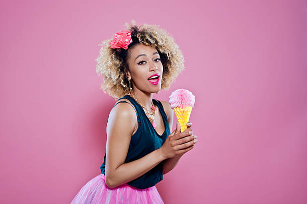 istock Cute young woman holding ice cream 636801070
