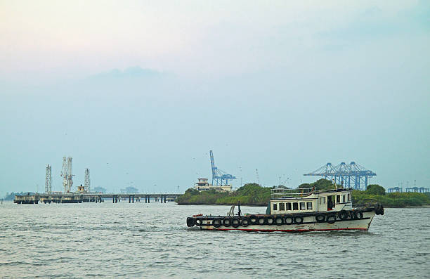 small motor boat against the background of sea port in Kochi, India