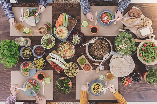 istock Friends eating vegetarian dinner 636801676
