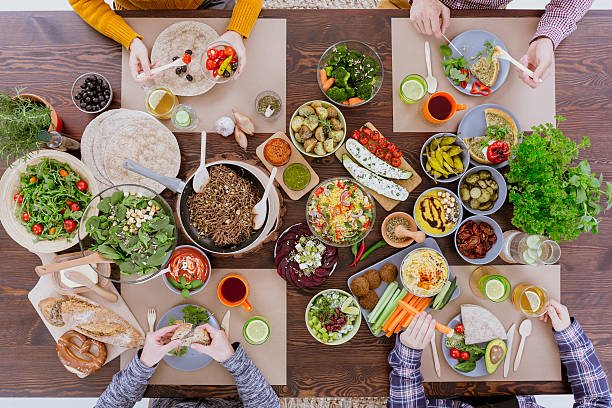 istock Friends eating healthy lunch 636801734