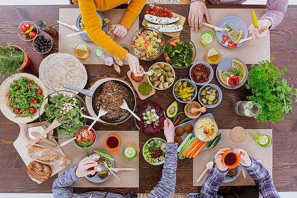 istock Group of people eating dinner 636801742