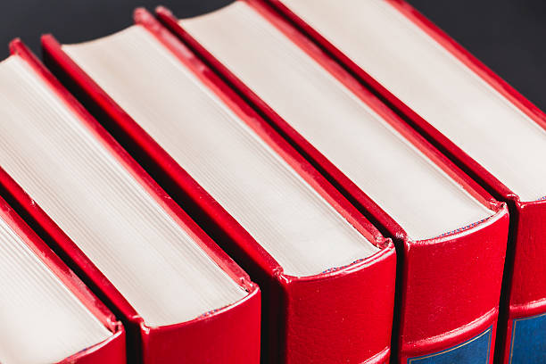 old encyclopedias on black background - book law instruction manual old imagens e fotografias de stock